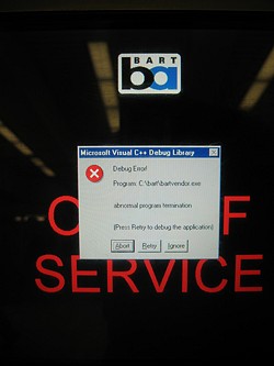 At least it didn't blue screen... A picture of the screen on a BART ticket terminal with a Windows error dialog indicating a C++ crash.